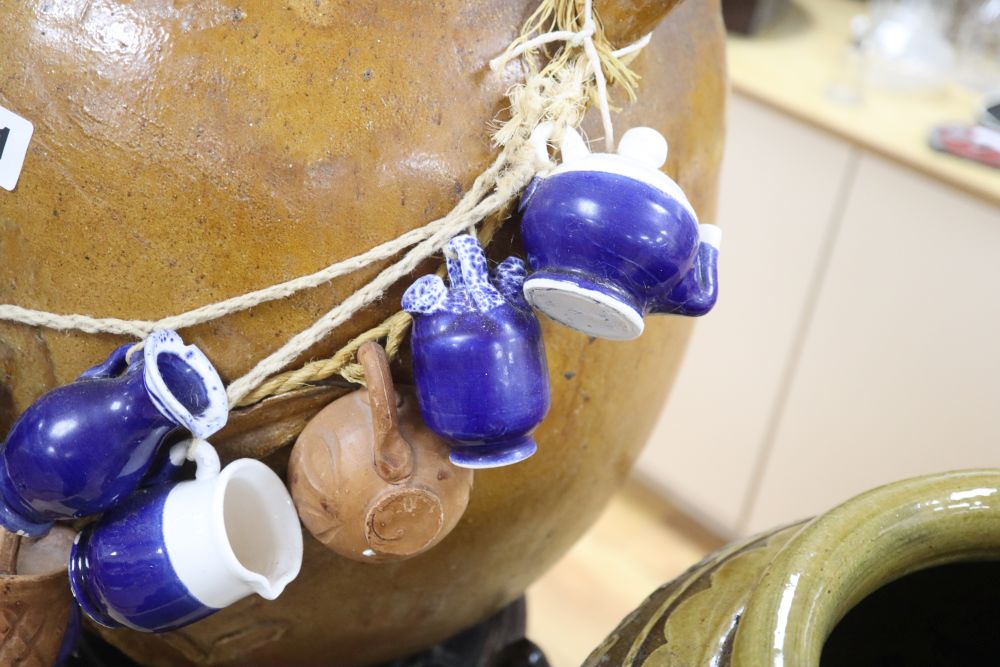 A Chinese straits earthenware matavan and a stoneware vessel on stand